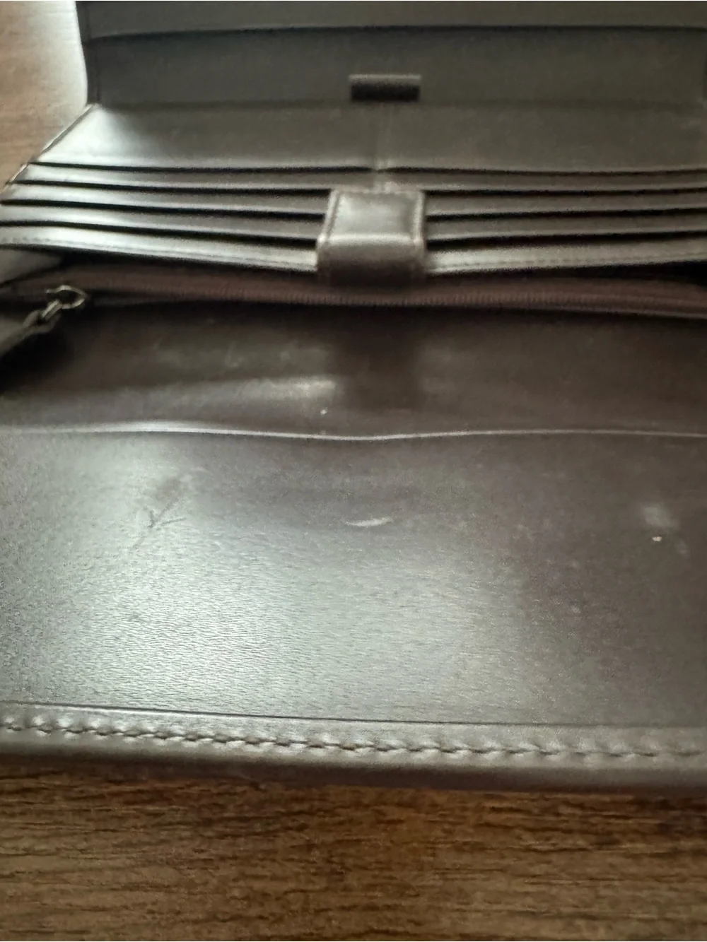 Dark Brown Coach Wallet with lots of card space, never used but has scratch